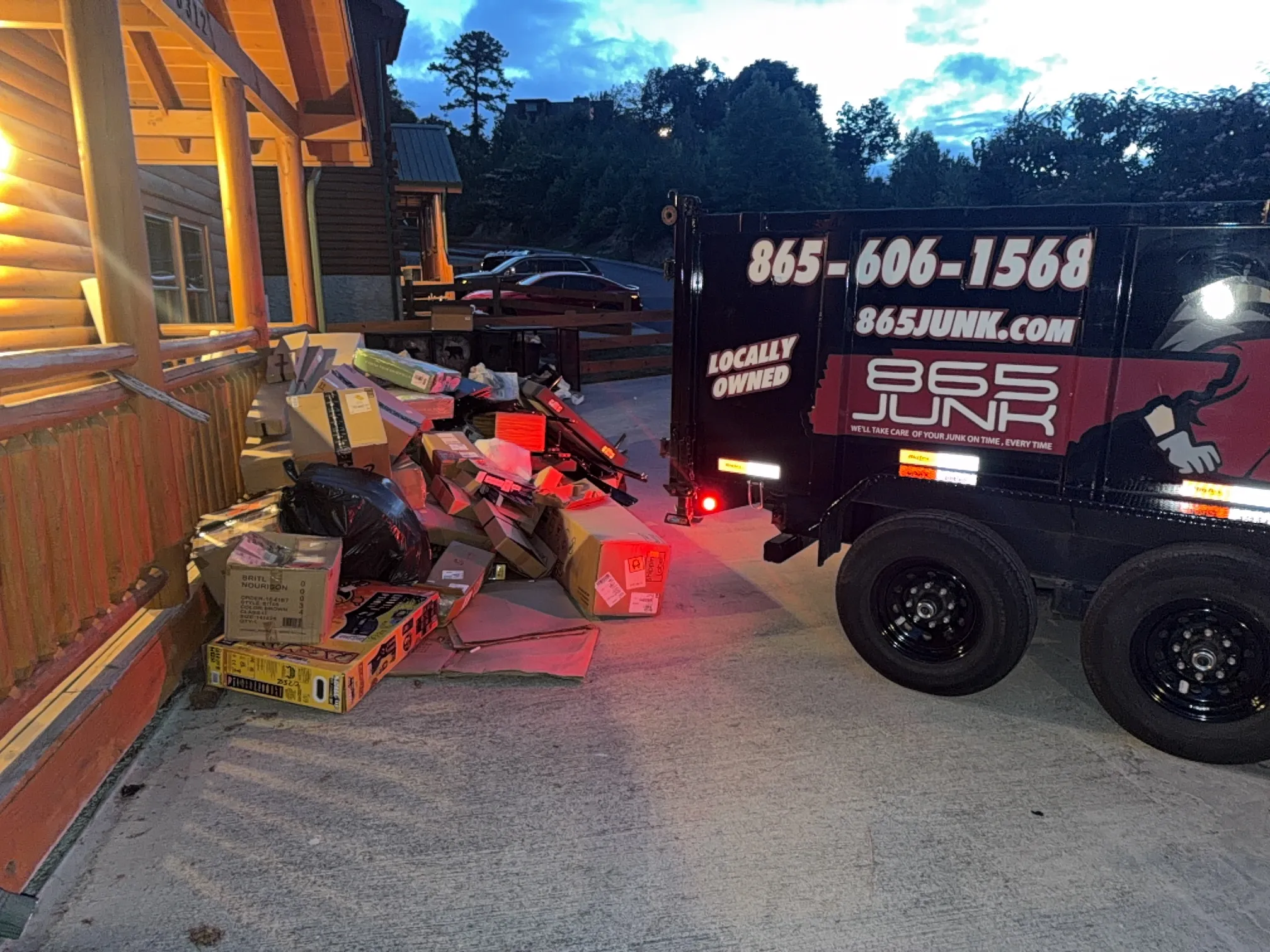 865 Junk trailer beside items ready for pickup